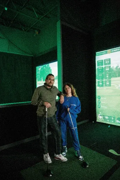 Ladies playing virtual golf